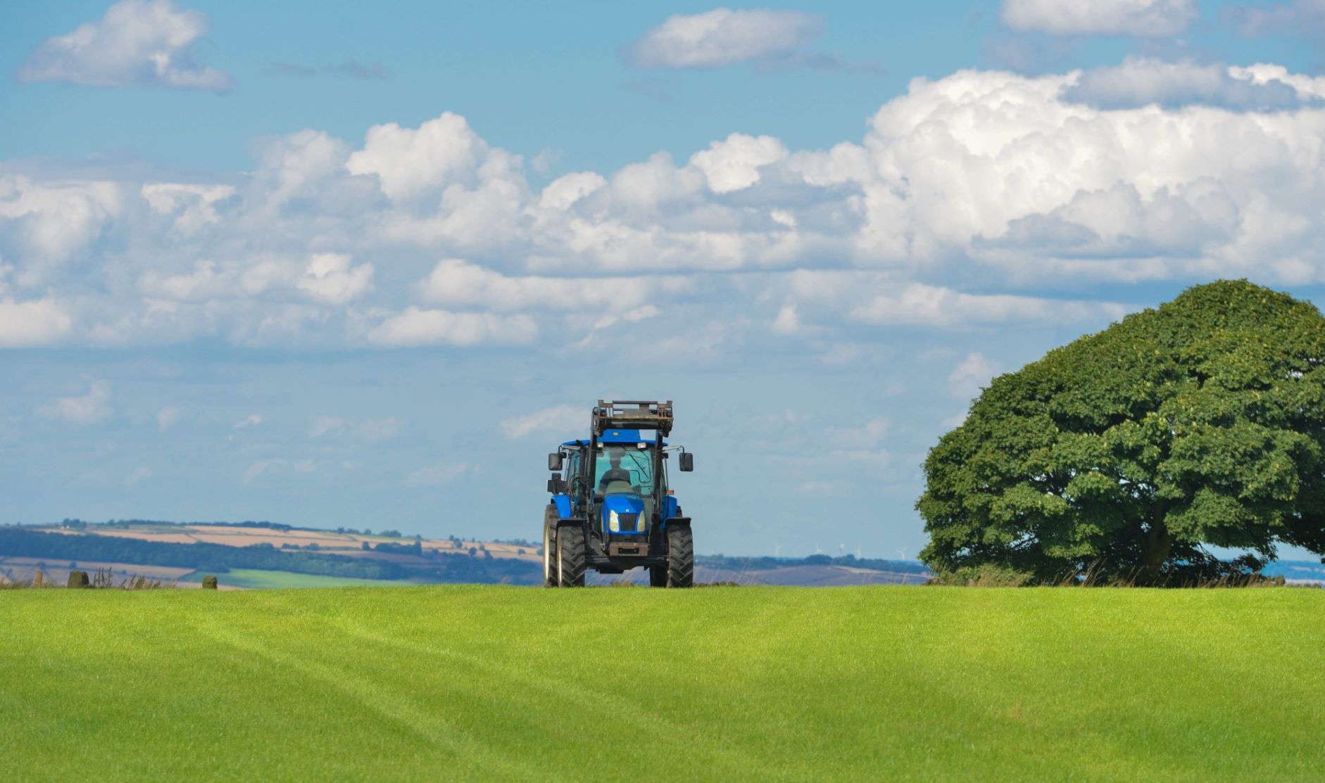 Tractor and an agriculture farm field